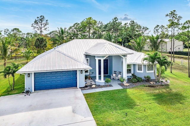 view of front of home featuring a garage and a front yard