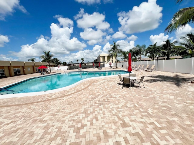 view of swimming pool with a patio area