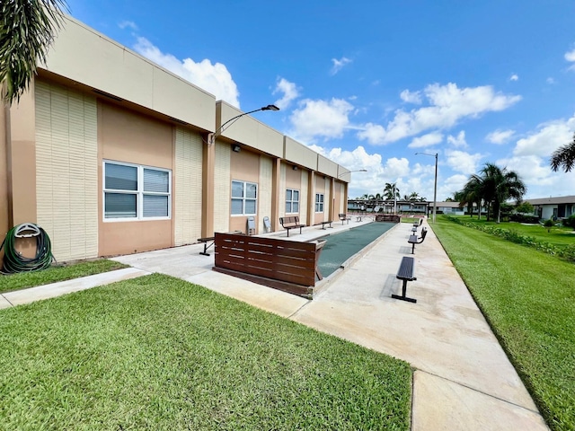 view of community featuring a yard