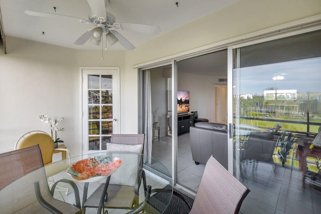 sunroom / solarium with ceiling fan