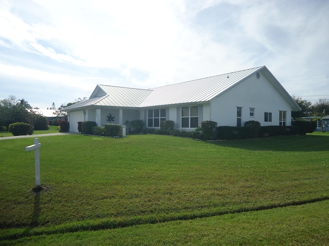 ranch-style house with a front yard and a garage