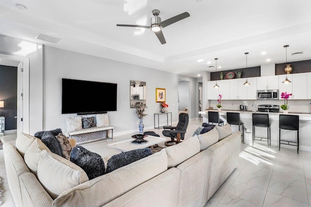 living room with ceiling fan