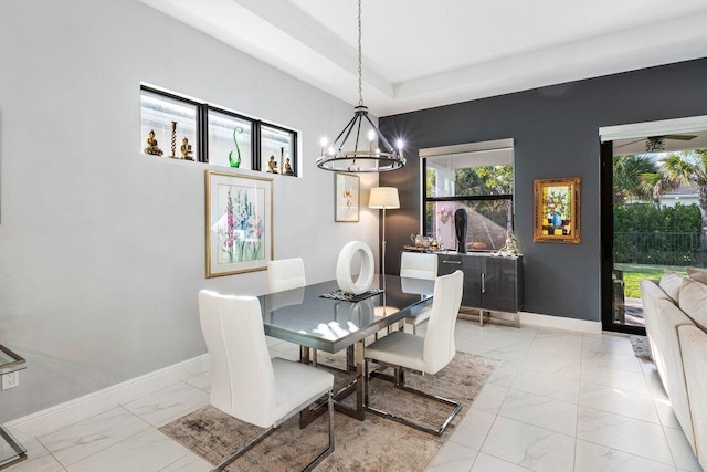 dining space featuring an inviting chandelier