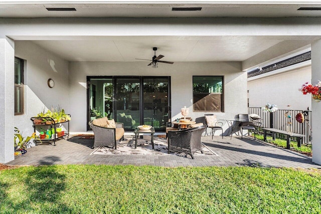 view of patio featuring ceiling fan