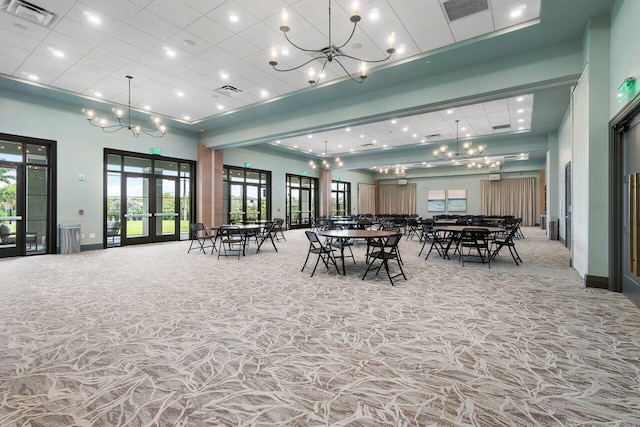 dining area featuring a high ceiling and french doors