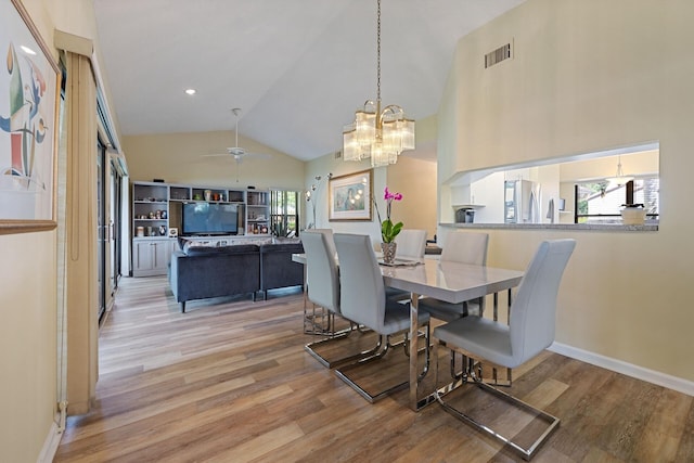 dining room with light wood-style floors, ceiling fan, visible vents, and baseboards