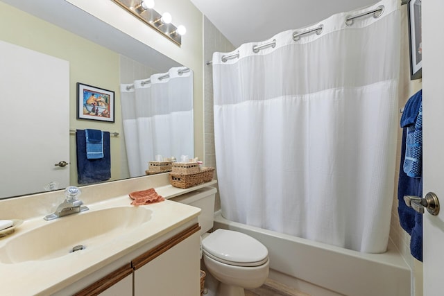 bathroom with vanity, shower / bath combination with curtain, and toilet