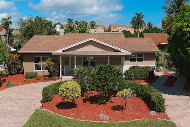 ranch-style house featuring a porch