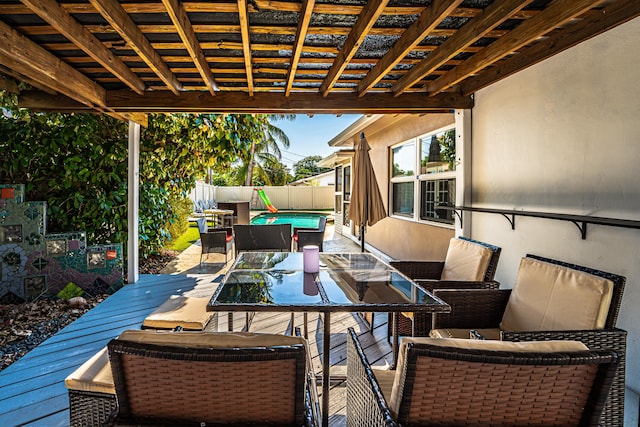 wooden terrace with a pool