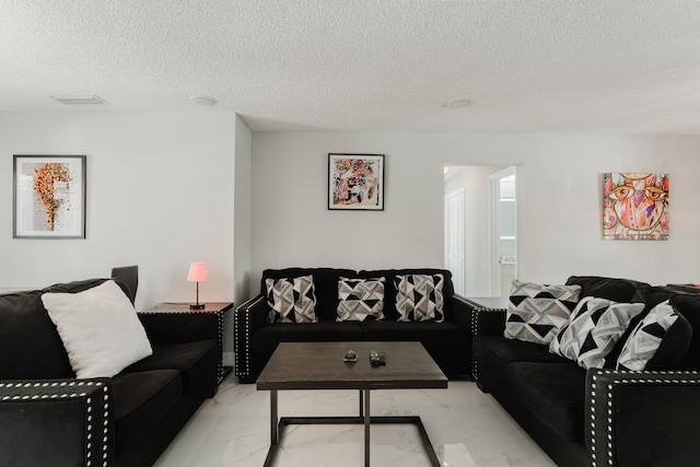 living room with a textured ceiling