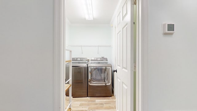 clothes washing area featuring washing machine and clothes dryer