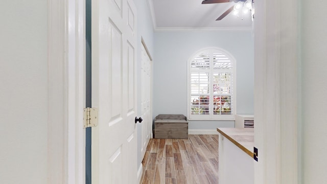 interior space with light hardwood / wood-style flooring and ornamental molding