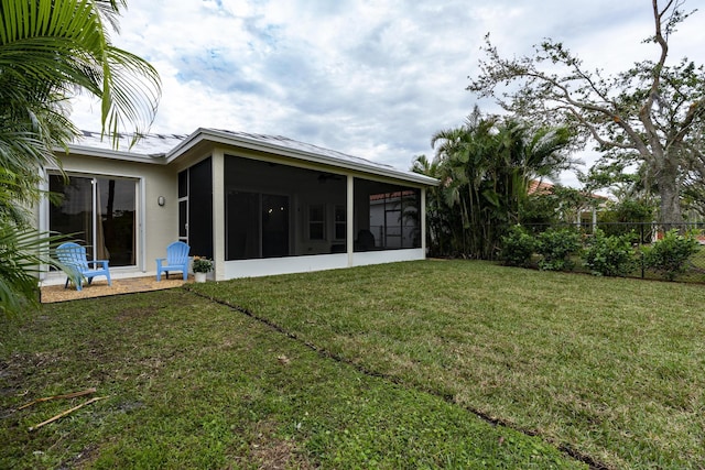 view of yard featuring a sunroom