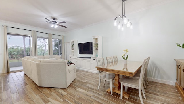 living room featuring ceiling fan with notable chandelier and ornamental molding