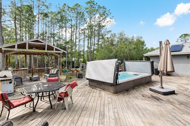 wooden terrace with a covered hot tub