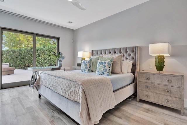 bedroom with ceiling fan and light hardwood / wood-style floors