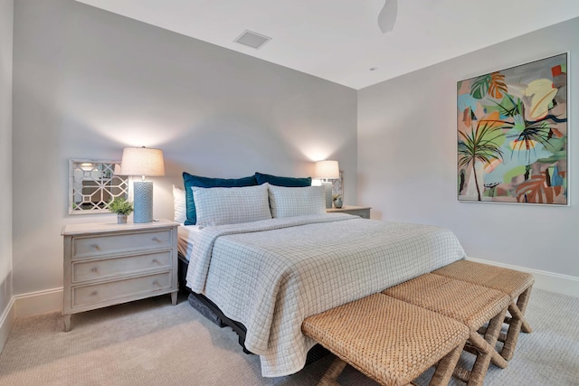 bedroom featuring ceiling fan and light colored carpet