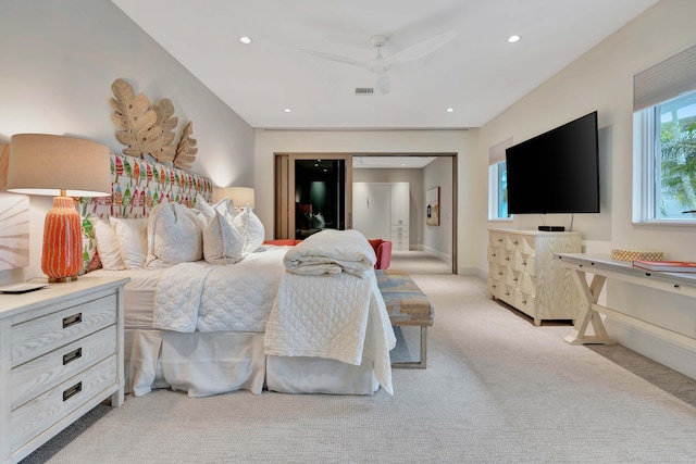 bedroom featuring ceiling fan and light colored carpet