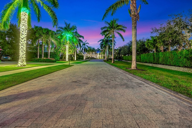 view of property's community with a lawn