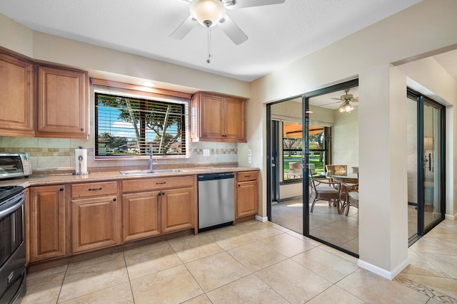 kitchen with dishwasher, sink, range with electric stovetop, backsplash, and light tile patterned flooring