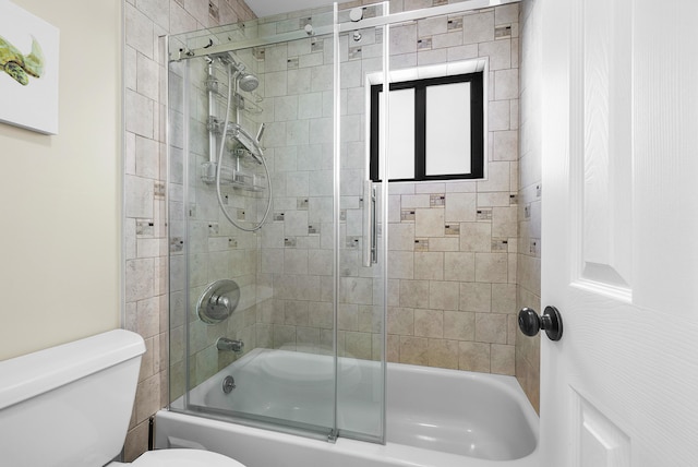 bathroom featuring toilet and enclosed tub / shower combo