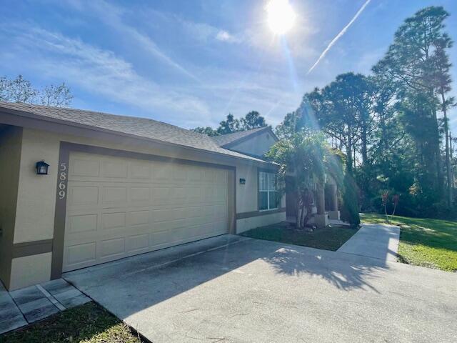 view of side of property featuring a garage