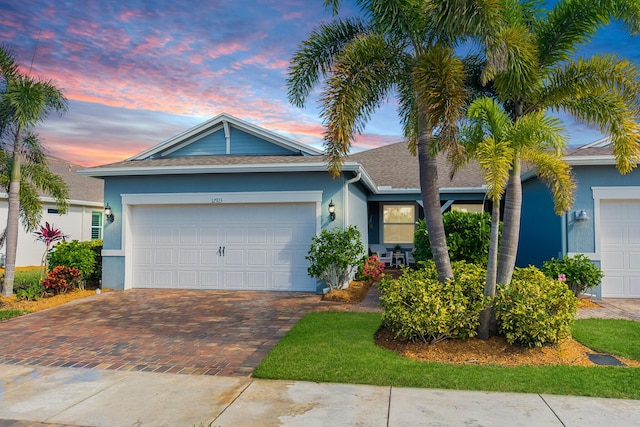 ranch-style house featuring a garage