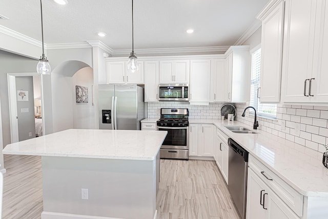 kitchen featuring a kitchen island, appliances with stainless steel finishes, and sink