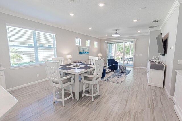 kitchen featuring stainless steel appliances, white cabinetry, pendant lighting, and sink