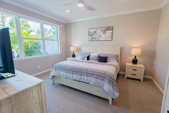 bedroom with carpet flooring, ceiling fan, and crown molding