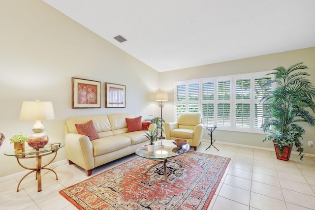 tiled living room with lofted ceiling