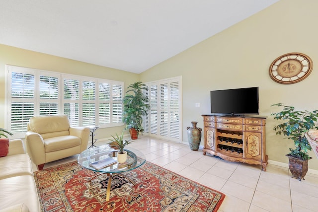 living room with light tile patterned floors and lofted ceiling