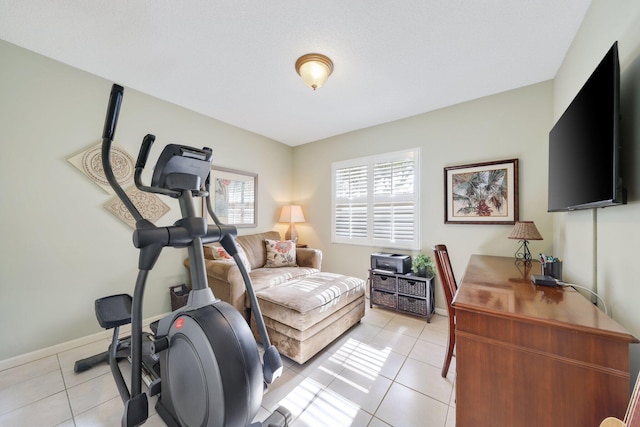 exercise room featuring light tile patterned flooring