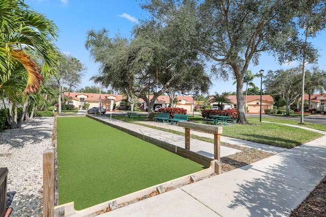 surrounding community with a lawn