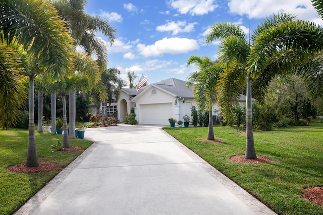 view of front of home with a garage and a front yard