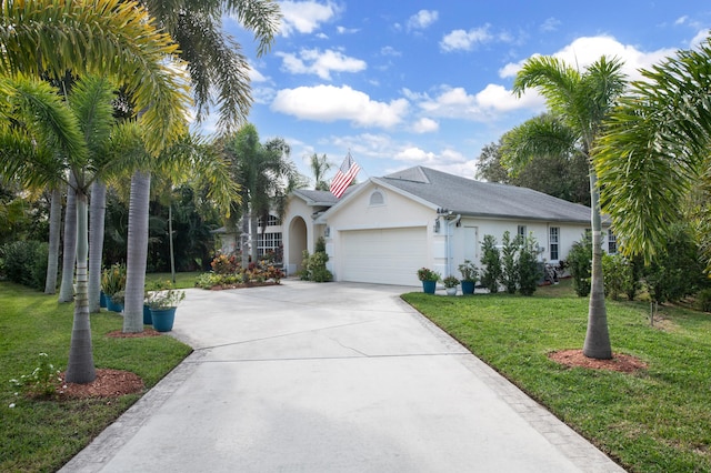 view of front of home featuring a front yard and a garage