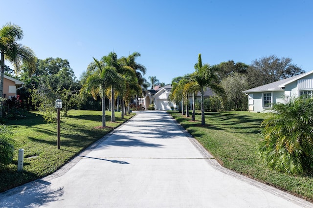 view of home's community with a yard