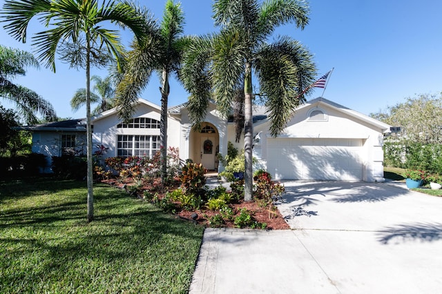 view of front of house with a front lawn and a garage