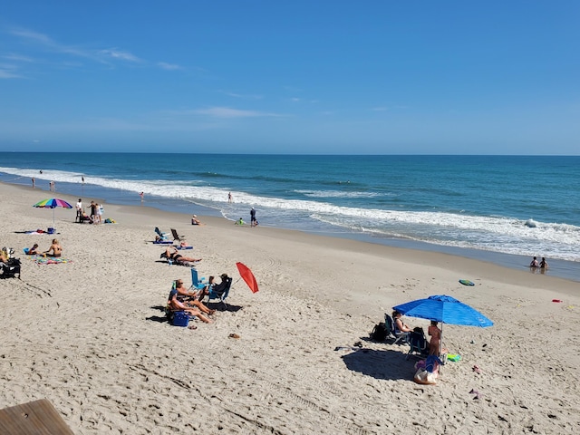 view of water feature with a beach view