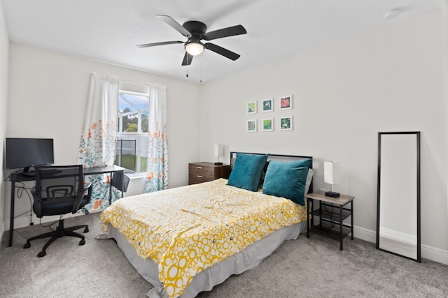 bedroom with ceiling fan and light carpet