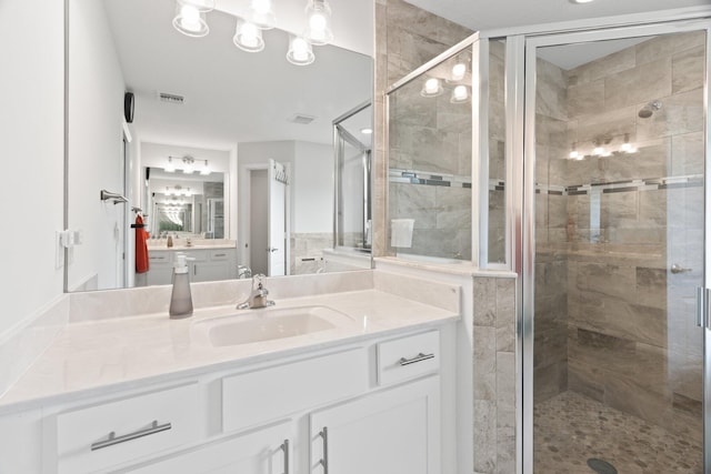 bathroom featuring vanity and walk in shower