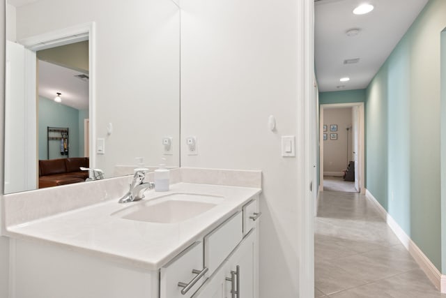 bathroom with tile patterned flooring and vanity