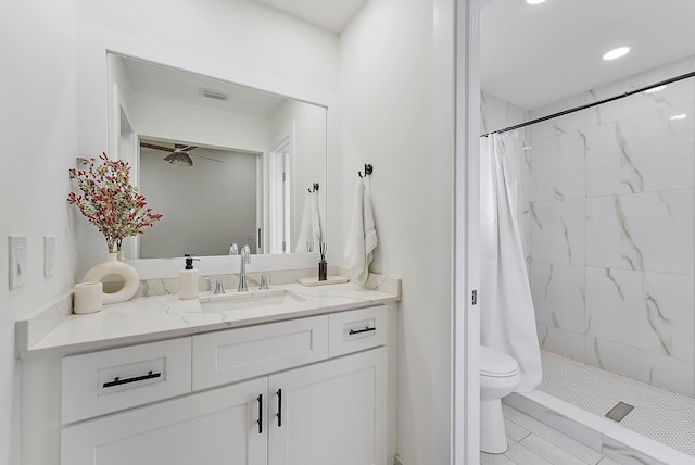 bathroom with vanity, toilet, and walk in shower