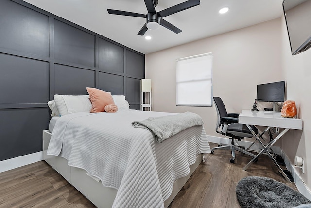 bedroom featuring ceiling fan and dark hardwood / wood-style flooring