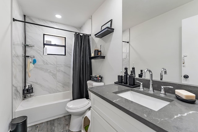 full bathroom featuring vanity, toilet, and shower / bathtub combination with curtain