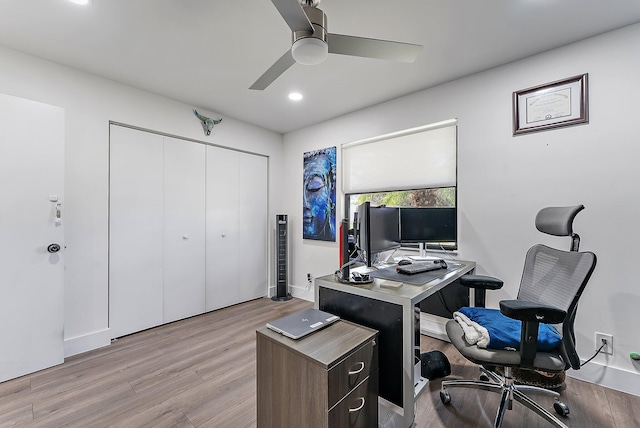 office space featuring light hardwood / wood-style flooring and ceiling fan