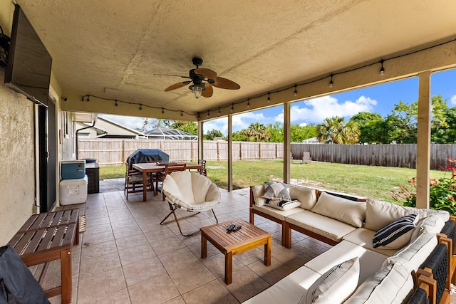 view of patio / terrace with area for grilling, ceiling fan, and an outdoor hangout area