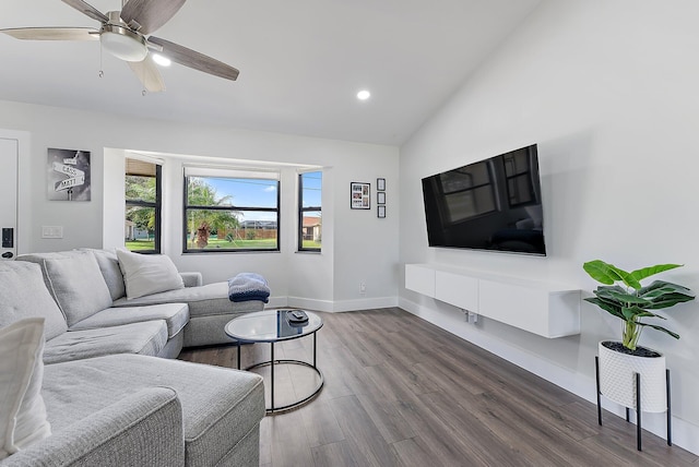 living room with ceiling fan, dark hardwood / wood-style flooring, and lofted ceiling