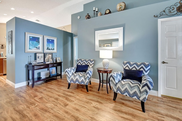 living area with light hardwood / wood-style flooring