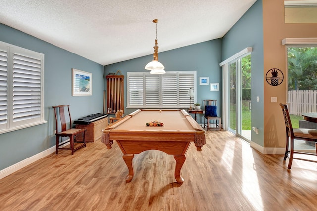 recreation room featuring a textured ceiling, light hardwood / wood-style flooring, vaulted ceiling, and billiards